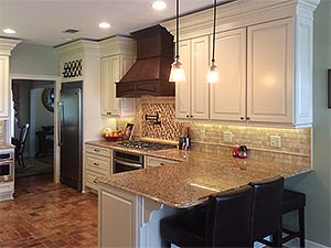 Kitchen remodel with custom cabinetry and custom tile work