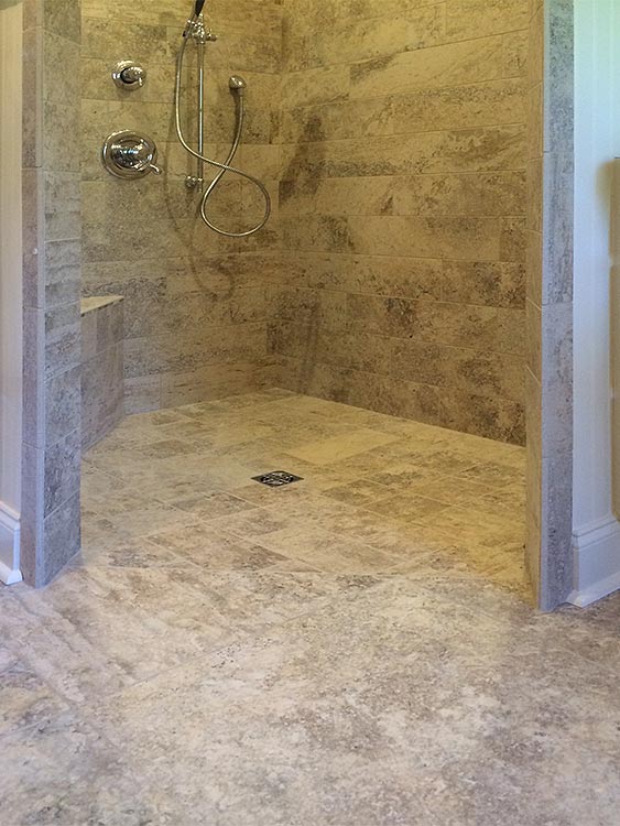 This accessible shower stall showcases custom tile work as well as barrier free design