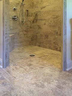 This accessible shower stall showcases custom tile work as well as barrier free design