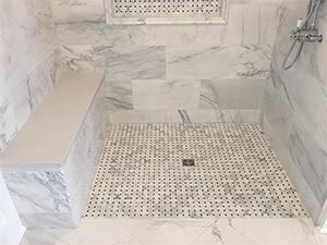 Barrier free curbless custom marble shower design